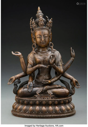 A Chinese Patinated Bronze Three-Faced Guanyin 1