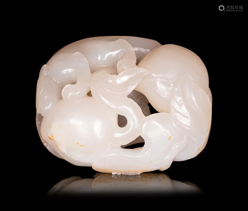 A White Jade Carving of Squirrel and Peaches