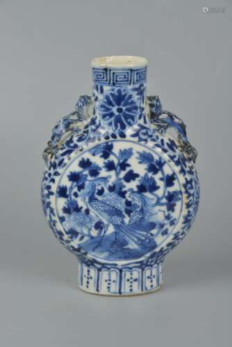 A blue and white vase with a phoenix motif