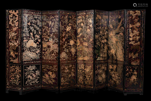 A Coromandel Lacquer Eight-Panel Floor Screen