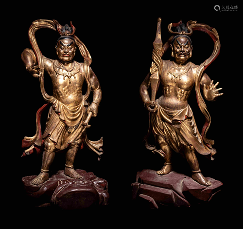 A Pair of Gilt and Red Lacquered Wood Figures of