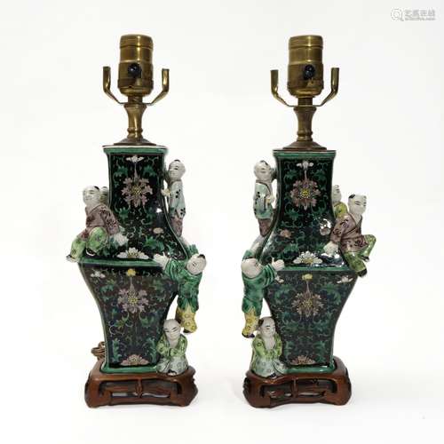 A pair of famille rose lamp holders with children's pattern,...