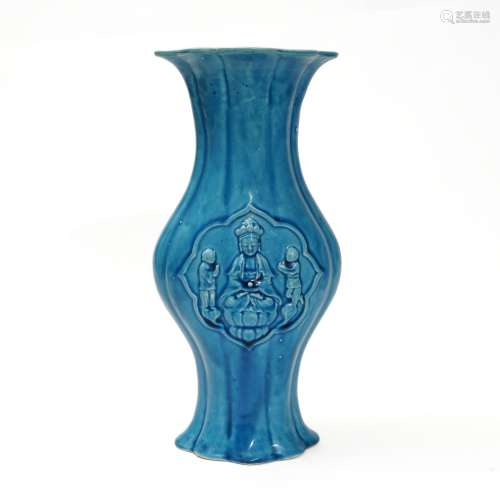 A peacock blue-glazed Guanyin vase, Qing Dynasty
清代孔雀蓝釉...