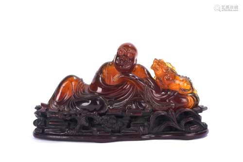 Chinese Amber Figure of Reclining Arhat and Tiger