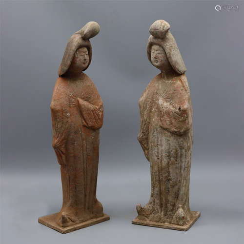 A PAIR OF PAINTED POTTERY PALACE MAID