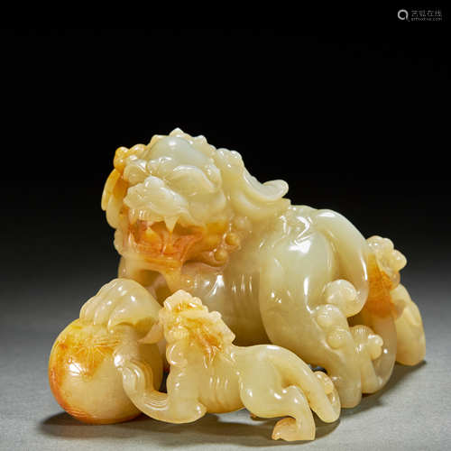 A FINE HETIAN JADE CARVED LION