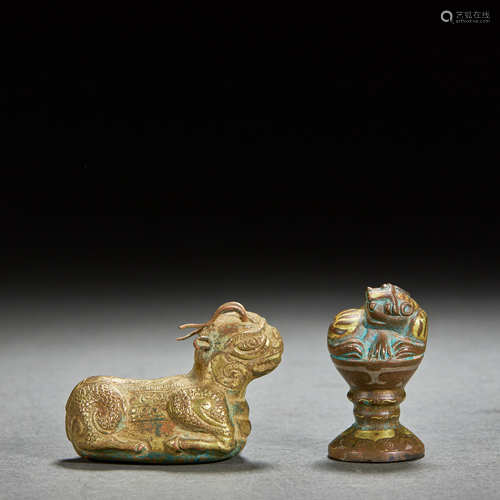 A PAIR OF GILT-BRONZE BEASTS