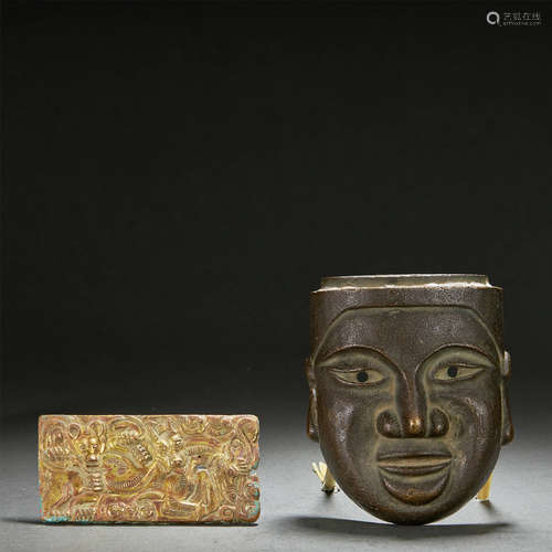 A GILT-BRONZE PANEL AND BRONZE MASK