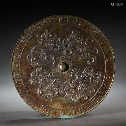 A BRONZE BEAST CIRCULAR MIRROR