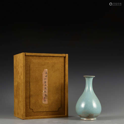 A CELADON-GLAZED VASE