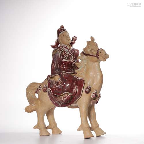 A UNDERGLAZE-RED PORCELAIN WARRIOR