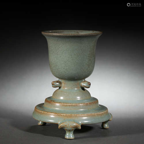 A CELADON-GLAZED CUP