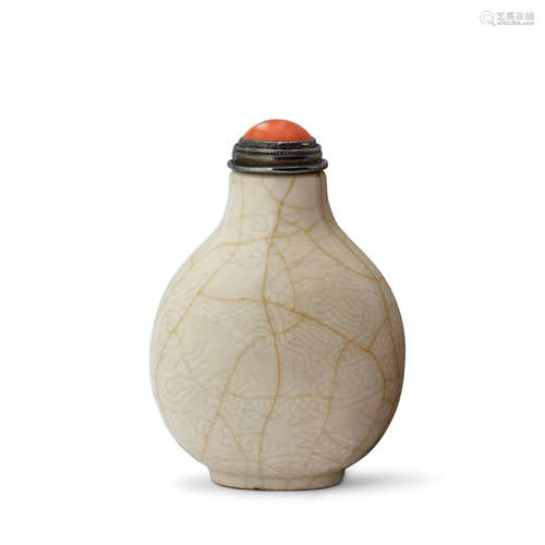 AN IMPERIAL INCISED AND CRACKLED 'ANHUA' WHITE-GLAZED SOFT-P...