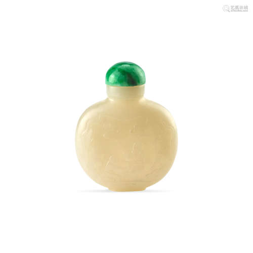 A carved white jade snuff bottle