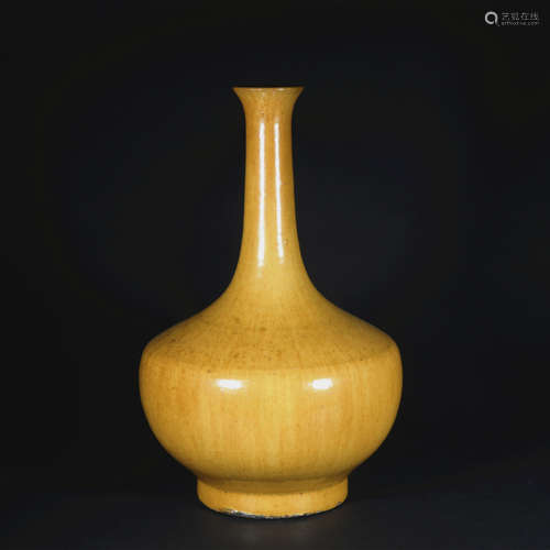 A yellow glazed vase