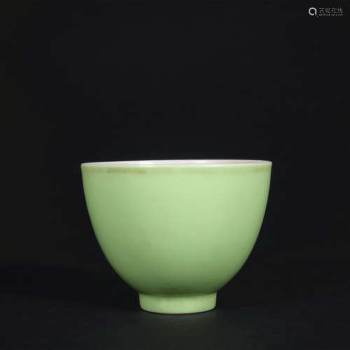 A green glazed cup