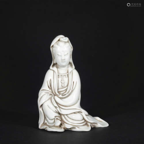 A white glazed statue of Guan Yin