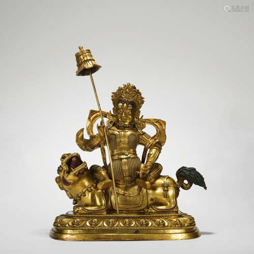 A gilt-bronze statue of Mammon