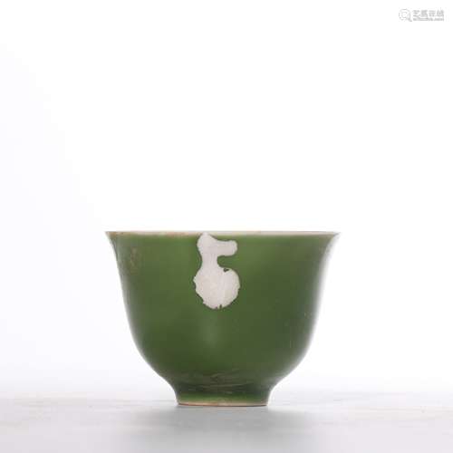 A green glazed cup