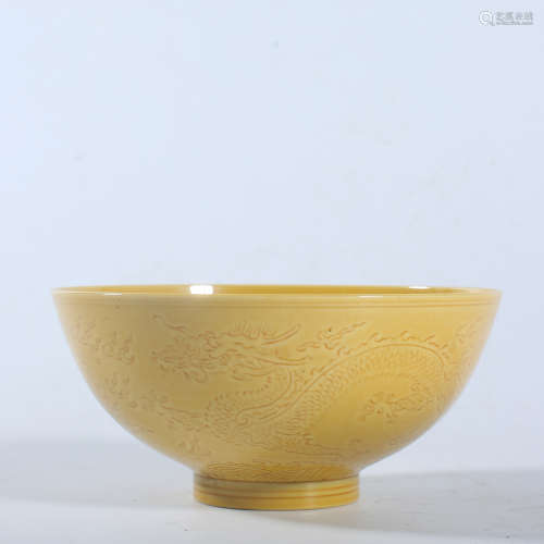 A yellow-glazed dark carved dragon bowl in Guangxu, Qing Dyn...