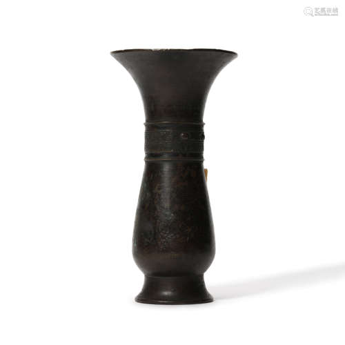 A Bronze Taotie Beaker Vase