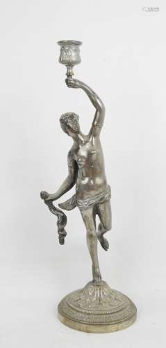 BOUGEOIR en bronze argenté représentant une femme à l'antiqu...