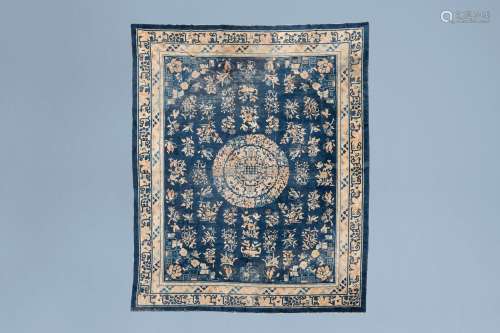 A Chinese Baotou rug with floral design, wool on cotton, fir...