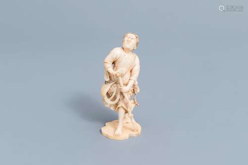 A Japanese ivory okimono of a surprised man, signed Yoshohid...