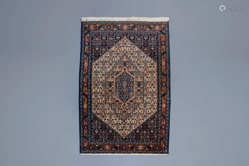 An Oriental rug with different designs, wool on cotton, Bidj...