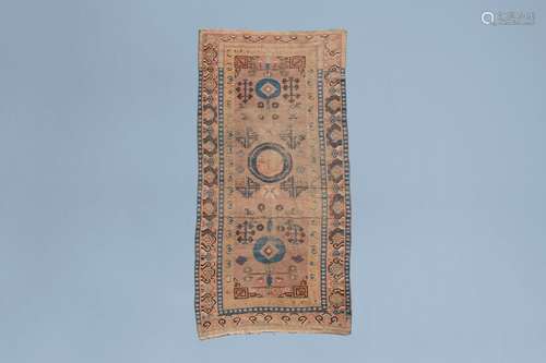 A Khotan rug with geometric design, wool on cotton, East Tur...