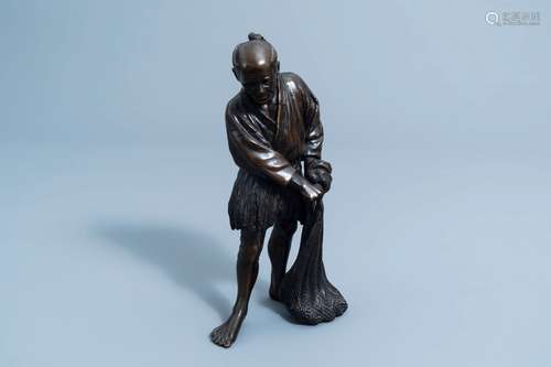 A Japanese bronze okimono of a fisherman, Meiji, 19th C.