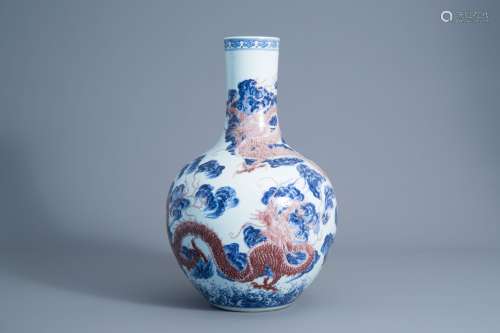 A large Chinese blue, white and copper red bottle shaped 'dr...