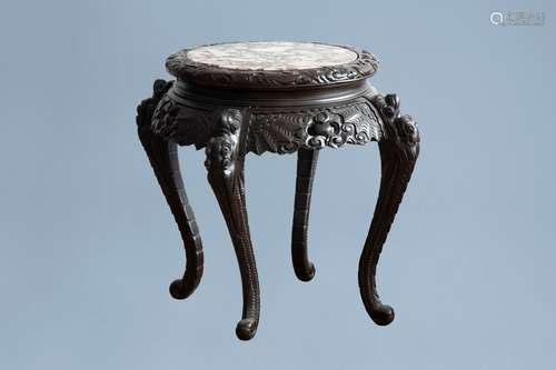 A Chinese or Japanese wooden table with marble top and drago...