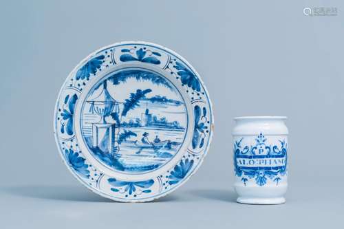 A Dutch Delft blue and white plate with an animated river la...