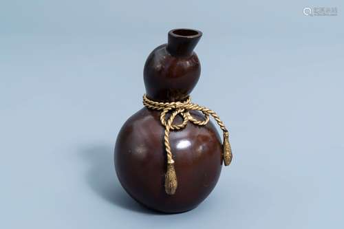 A Japanese bronze double gourd shaped vase with a bow, signe...