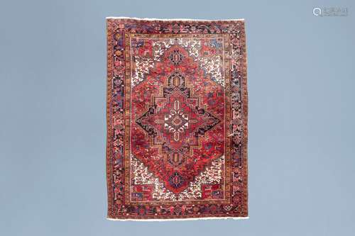 An Oriental Heriz rug with floral design, wool on cotton, Pe...