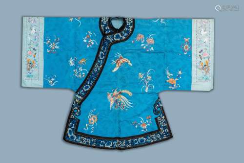 A Chinese blue ground embroidered silk women's robe with flo...