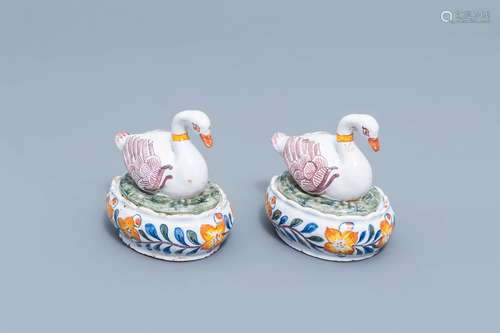 A pair of Dutch Delft tureens and covers in the shape of a s...