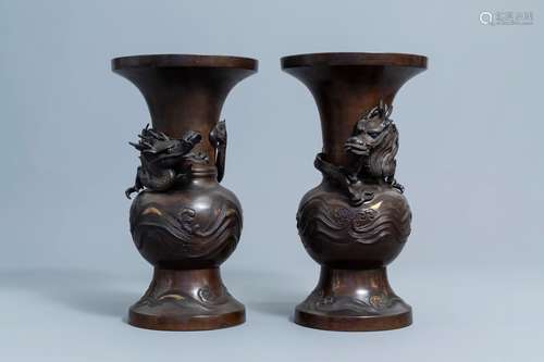 A pair of Japanese bronze relief decorated 'dragon' vases, M...