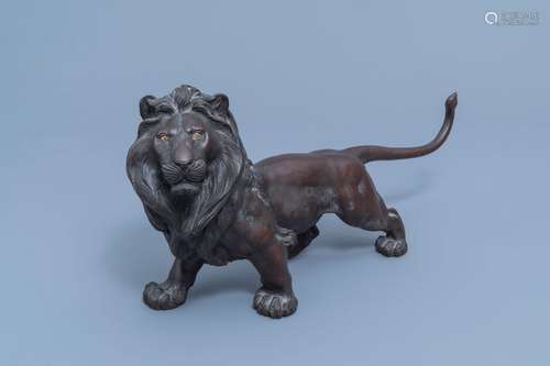 A Japanese bronze sculpture of a lion, probably signed Toku ...