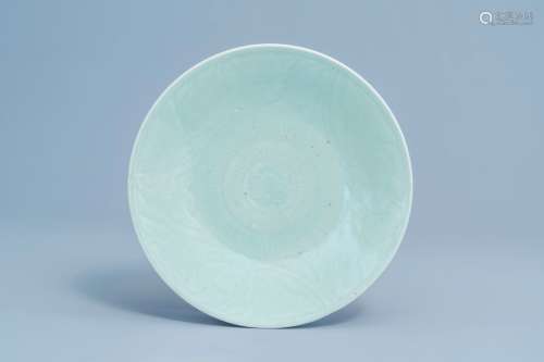 A Chinese celadon plate with floral anhua design, 19th C.