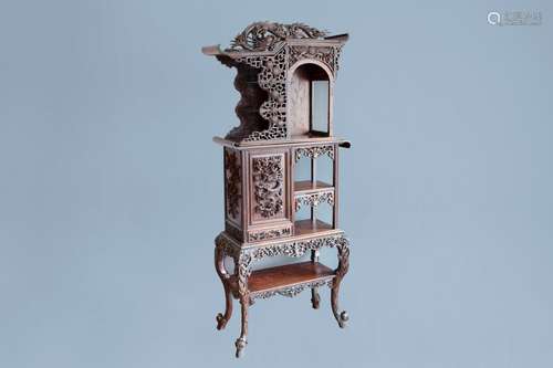 A Chinese reticulated wooden 'dragons' display cabinet, ca. ...