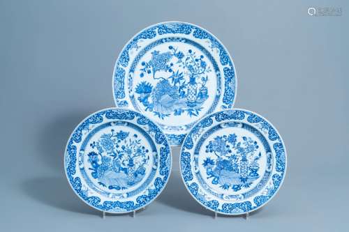 Three Chinese blue and white chargers with antiquities and f...