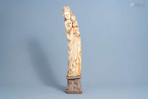 A French Gothic revival carved ivory group of Madonna and Ch...