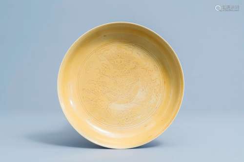 A Chinese yellow glazed anhua 'dragon' plate, Wanli mark, 19...