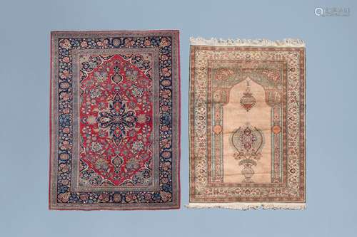 A Persian Mashad rug and a Turkish Kayseri rug with floral d...