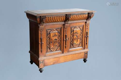 A Flemish oak wooden buffet dresser with architectural desig...