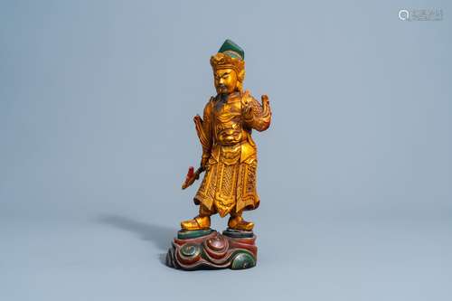 A Chinese gilt and lacquered wooden figure of Guandi, 18th/1...