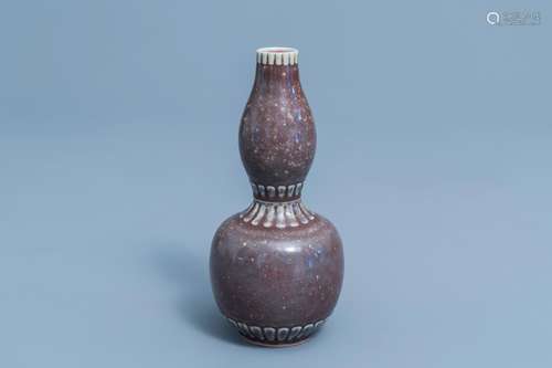 A Chinese monochrome 'peach bloom' glazed double gourd vase,...