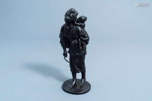 A Japanese bronze okimono of a mother and child on their way...